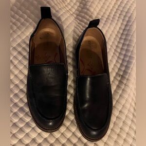 Black leather lug sole loafers